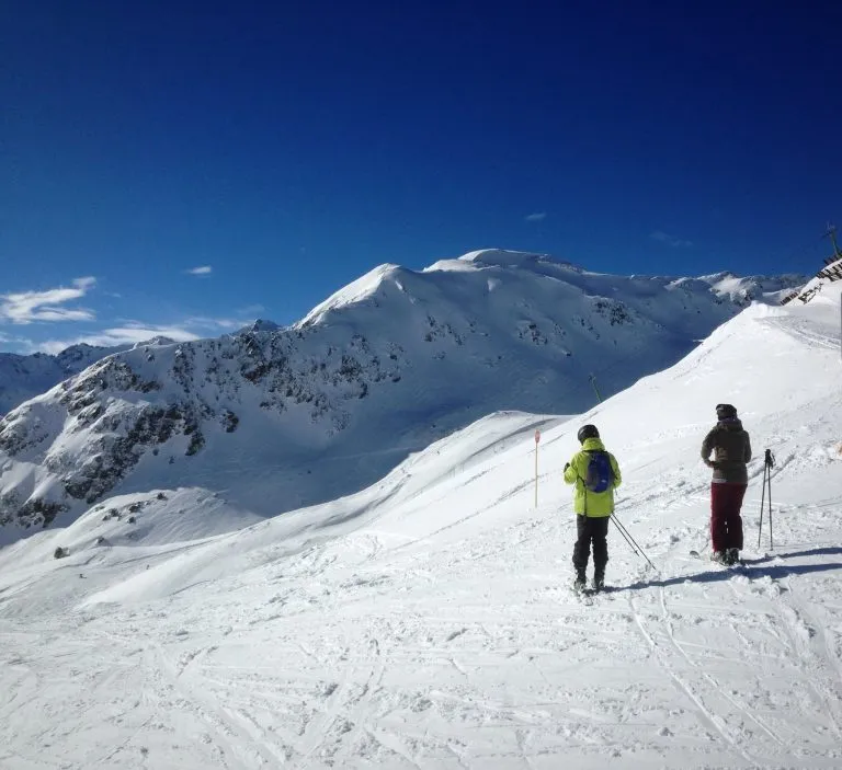 skiers moutains landscape